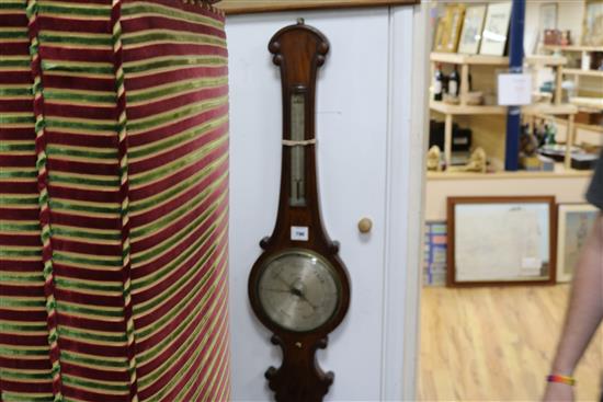 A 19th century Griffin & Hyams barometer made from oak from Royal Exchange fire 1838 W.26cm.